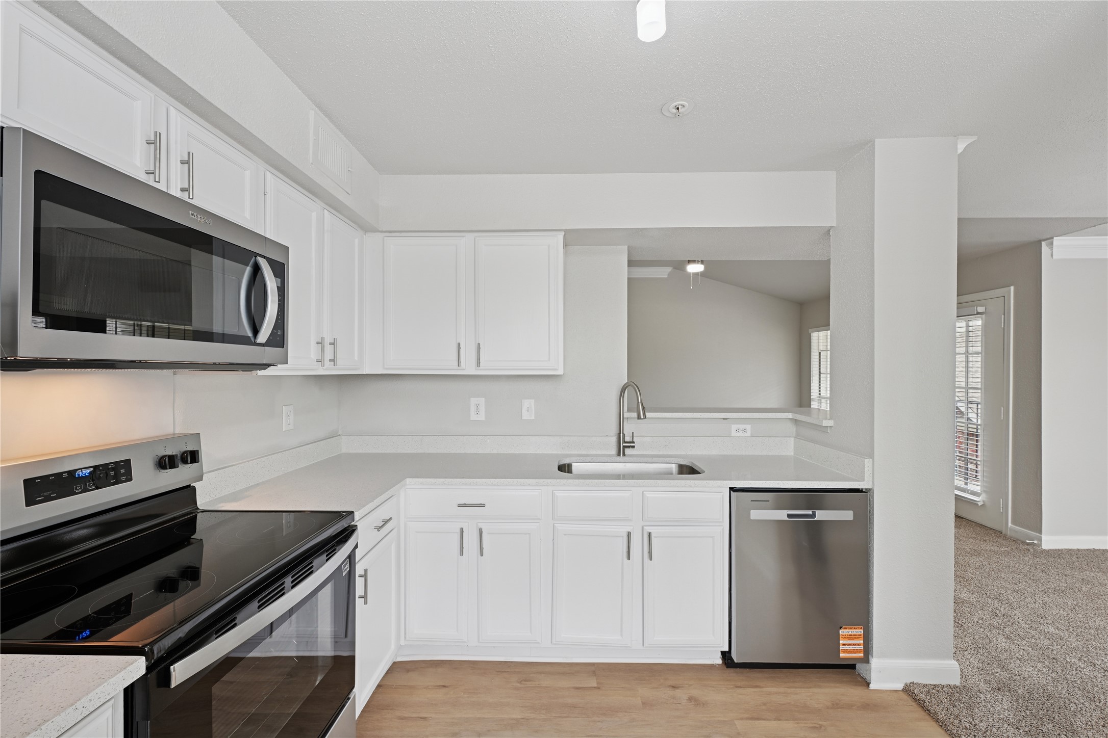 10990 West Road, Unit 203 Houston, TX 77064 - Photo 14 of 23 a kitchen with a sink stainless steel appliances and cabinets