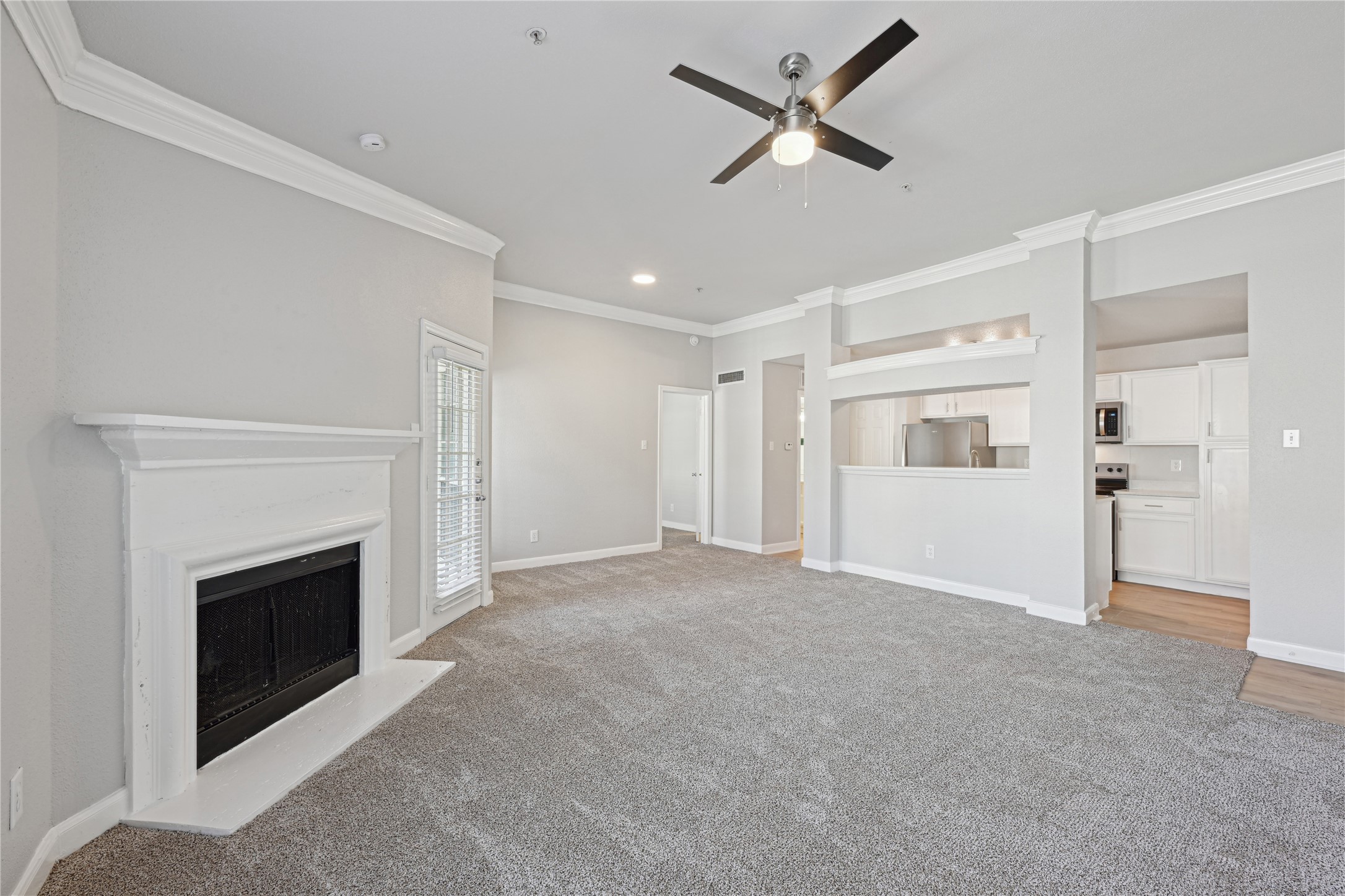 10990 West Road, Unit 203 Houston, TX 77064 - Photo 15 of 23 a view of empty room with fan and fireplace