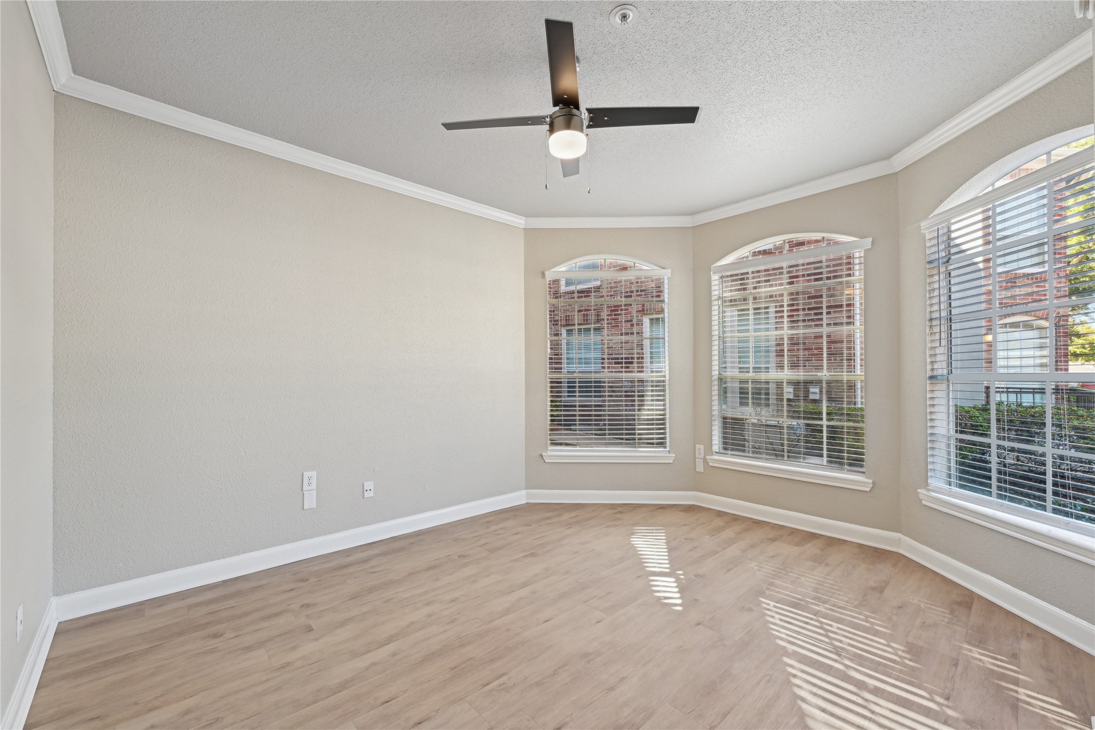 10990 West Road, Unit 203 Houston, TX 77064 - Photo 17 of 23 an empty room with wooden floor and windows