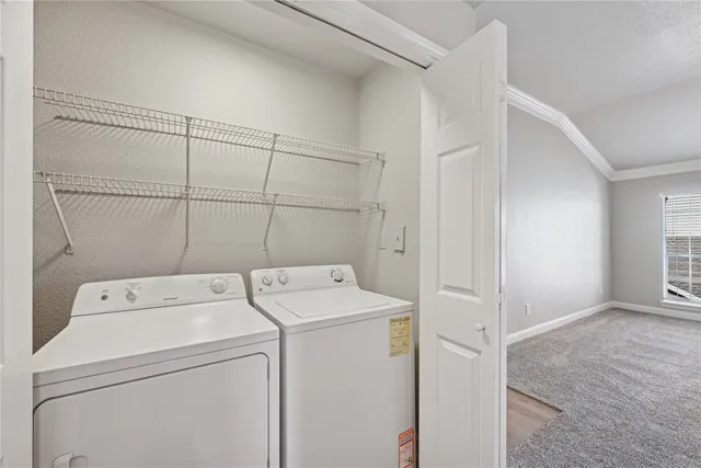 a utility room with dryer and washer