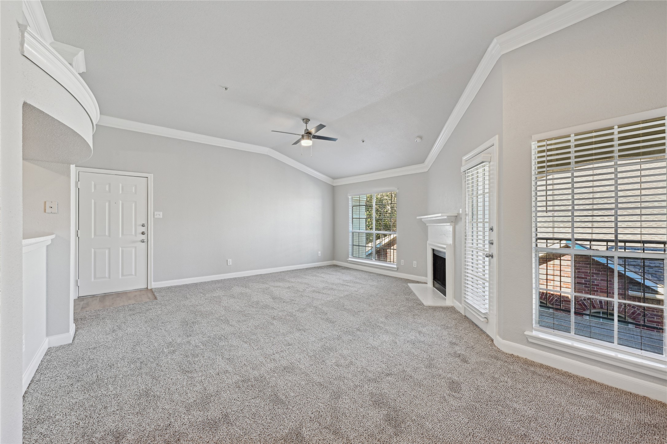 10990 West Road, Unit 203 Houston, TX 77064 - Photo 20 of 23 a view of a livingroom with a ceiling fan and window