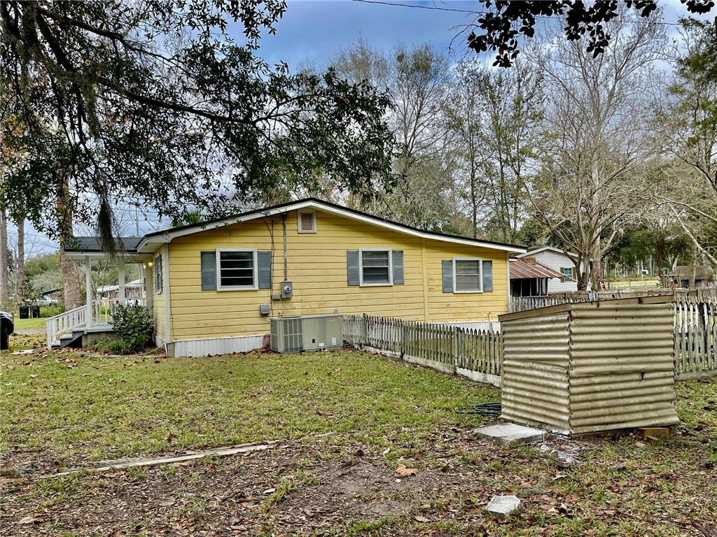 86114 Harry Green Road Yulee, FL 32097 - Photo 14 of 24 a view of a house with a yard
