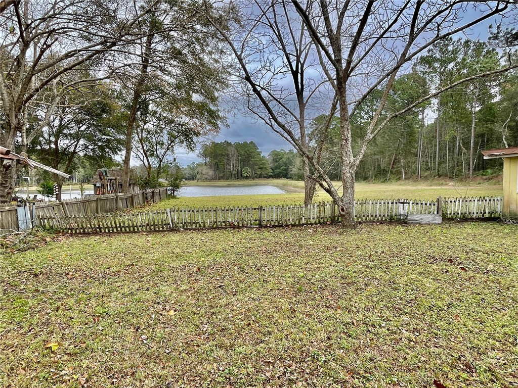 86114 Harry Green Road Yulee, FL 32097 - Photo 15 of 24 a view of a yard with large trees