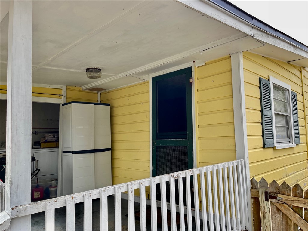 86114 Harry Green Road Yulee, FL 32097 - Photo 17 of 24 a view of a house with a door