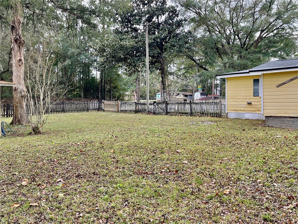 86114 Harry Green Road Yulee, FL 32097 - Photo 24 of 24 a view of a house with a yard