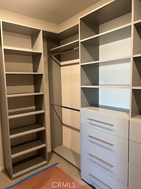 29901 Bridlegate Way Menifee, CA 92584 - Photo 19 of 43 a view of walk in closet with empty racks