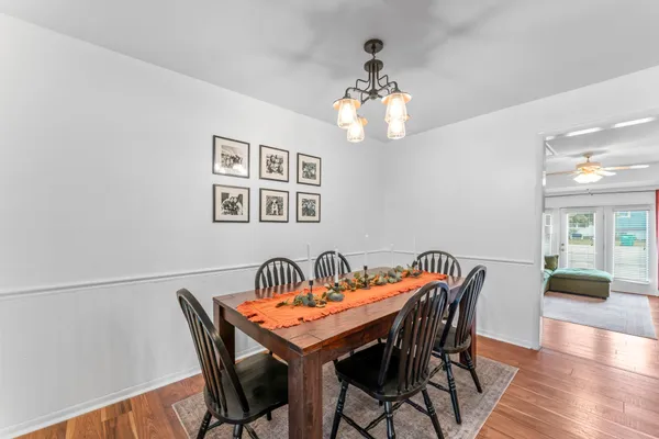 a view of a dining room with furniture and wooden floor