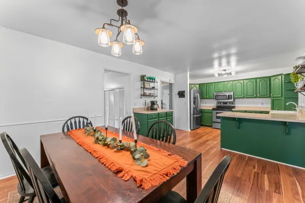 a view of a dining room with furniture window and wooden floor