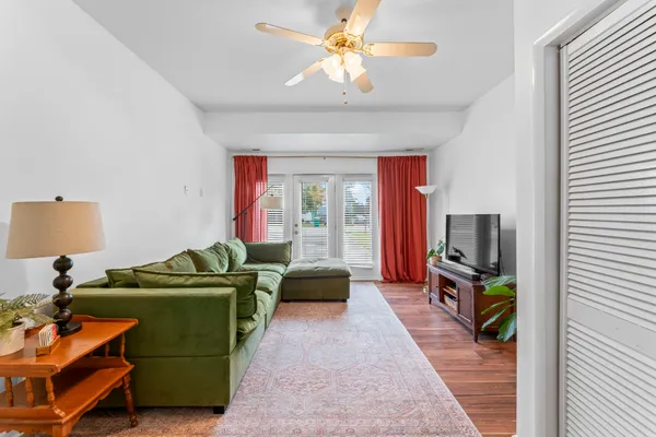 a living room with furniture and a flat screen tv