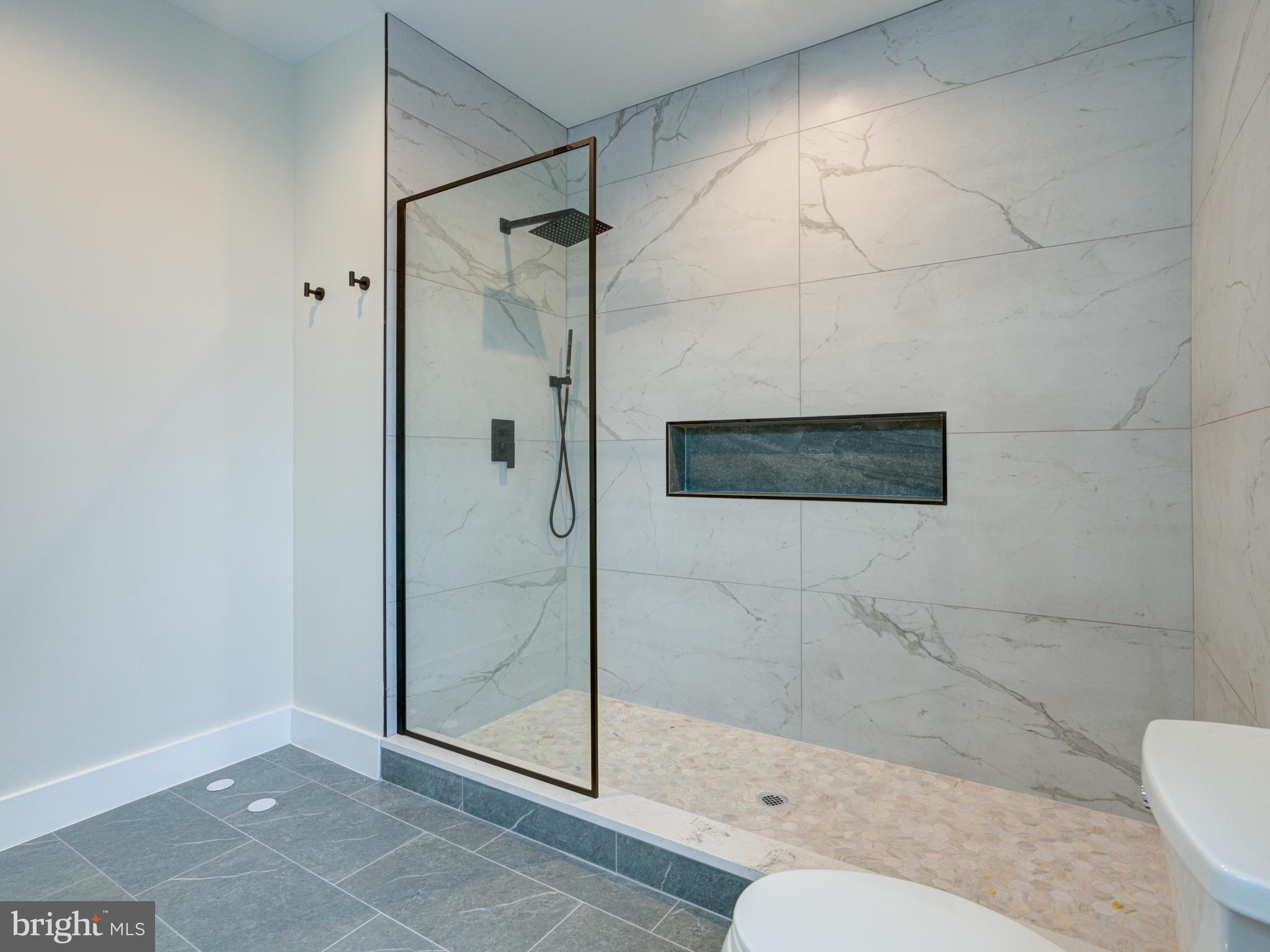 630 Moyer Street Philadelphia, PA 19125 - Photo 16 of 41 a bathroom with a shower a toilet and a sink