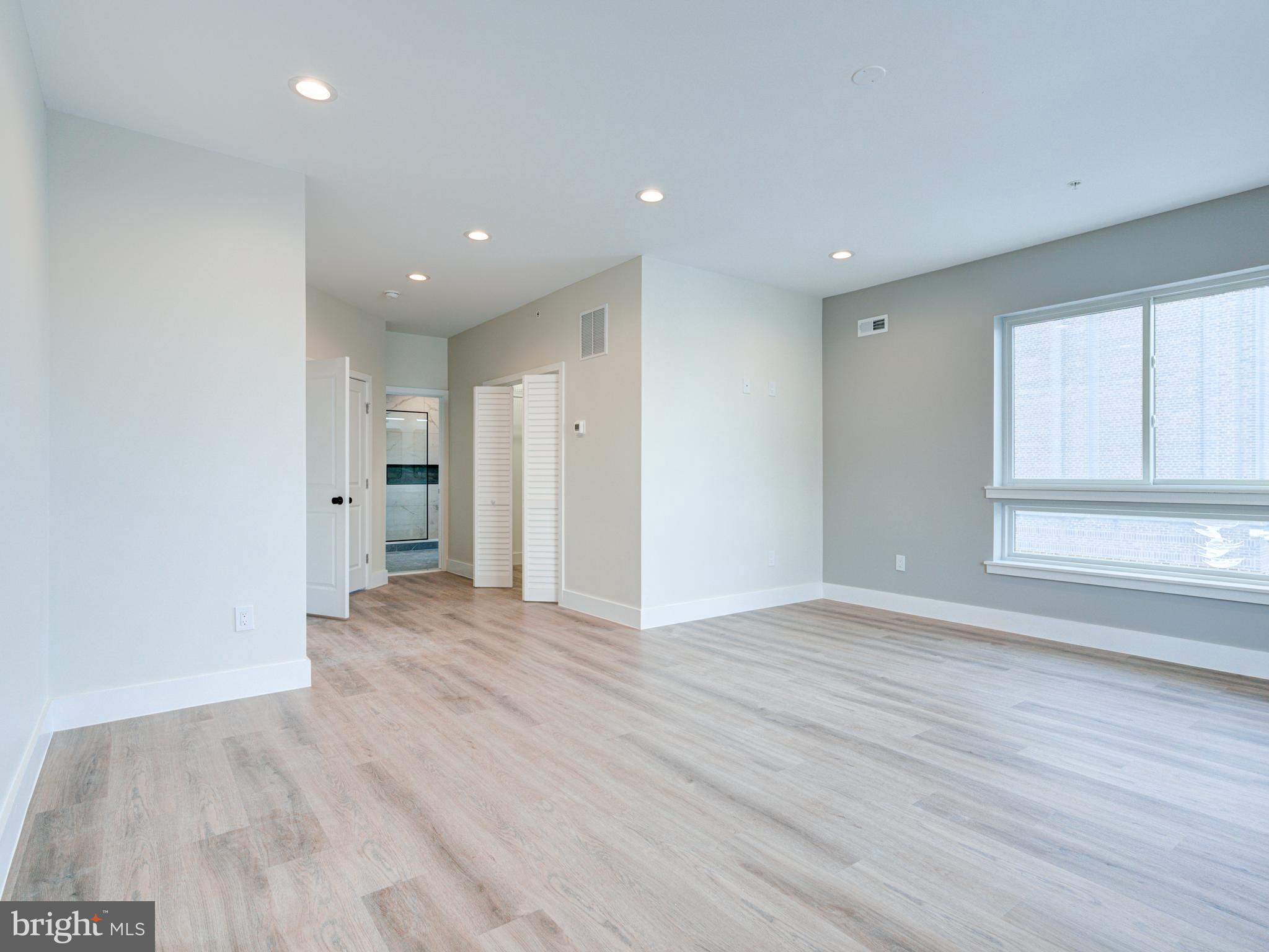 630 Moyer Street Philadelphia, PA 19125 - Photo 21 of 41 wooden floor in an empty room with a window