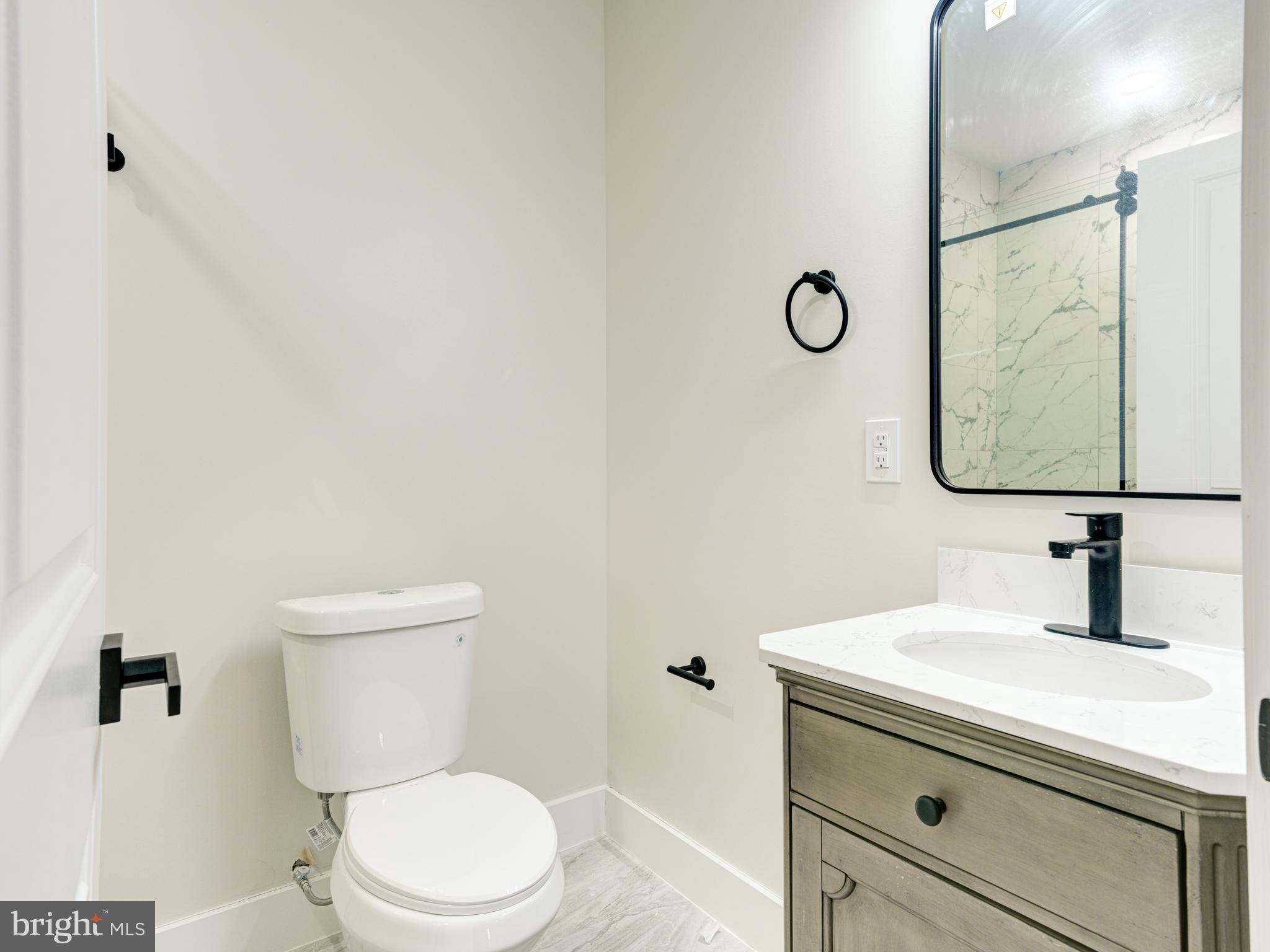 630 Moyer Street Philadelphia, PA 19125 - Photo 25 of 41 a bathroom with a sink toilet vanity and shower