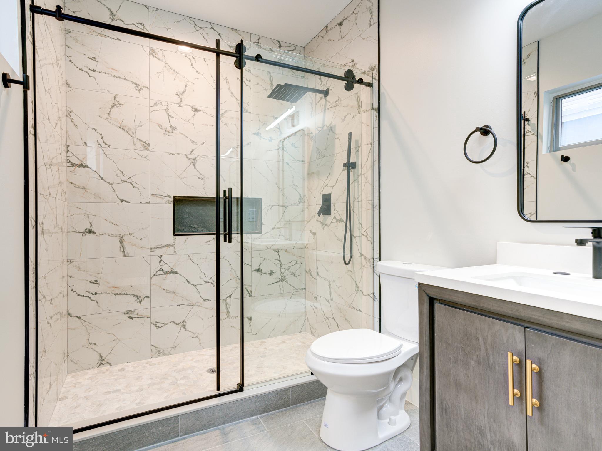 630 Moyer Street Philadelphia, PA 19125 - Photo 35 of 41 a bathroom with a shower a toilet and a sink
