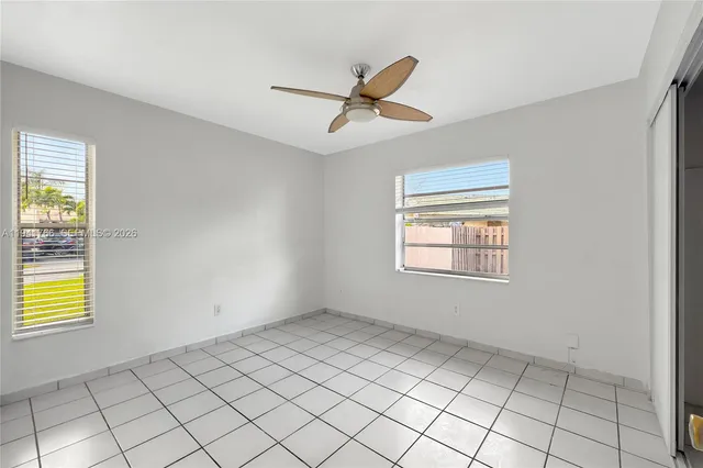 a view of an empty room and window