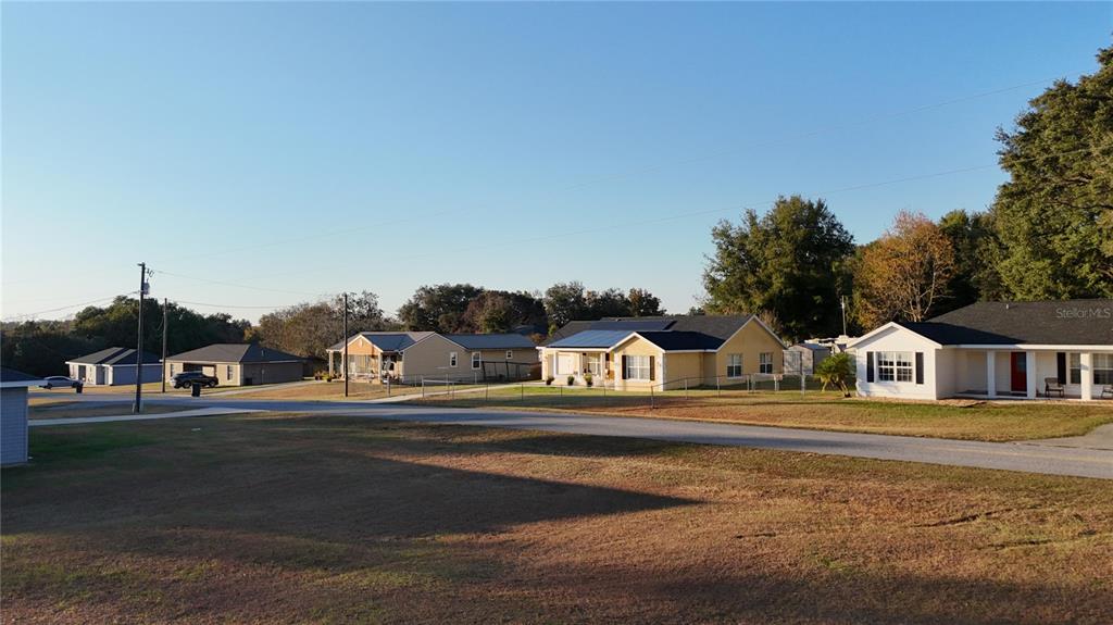 Northwest 65th Street Ocala, FL 34475 - Photo 6 of 12 a front view of a house with a yard