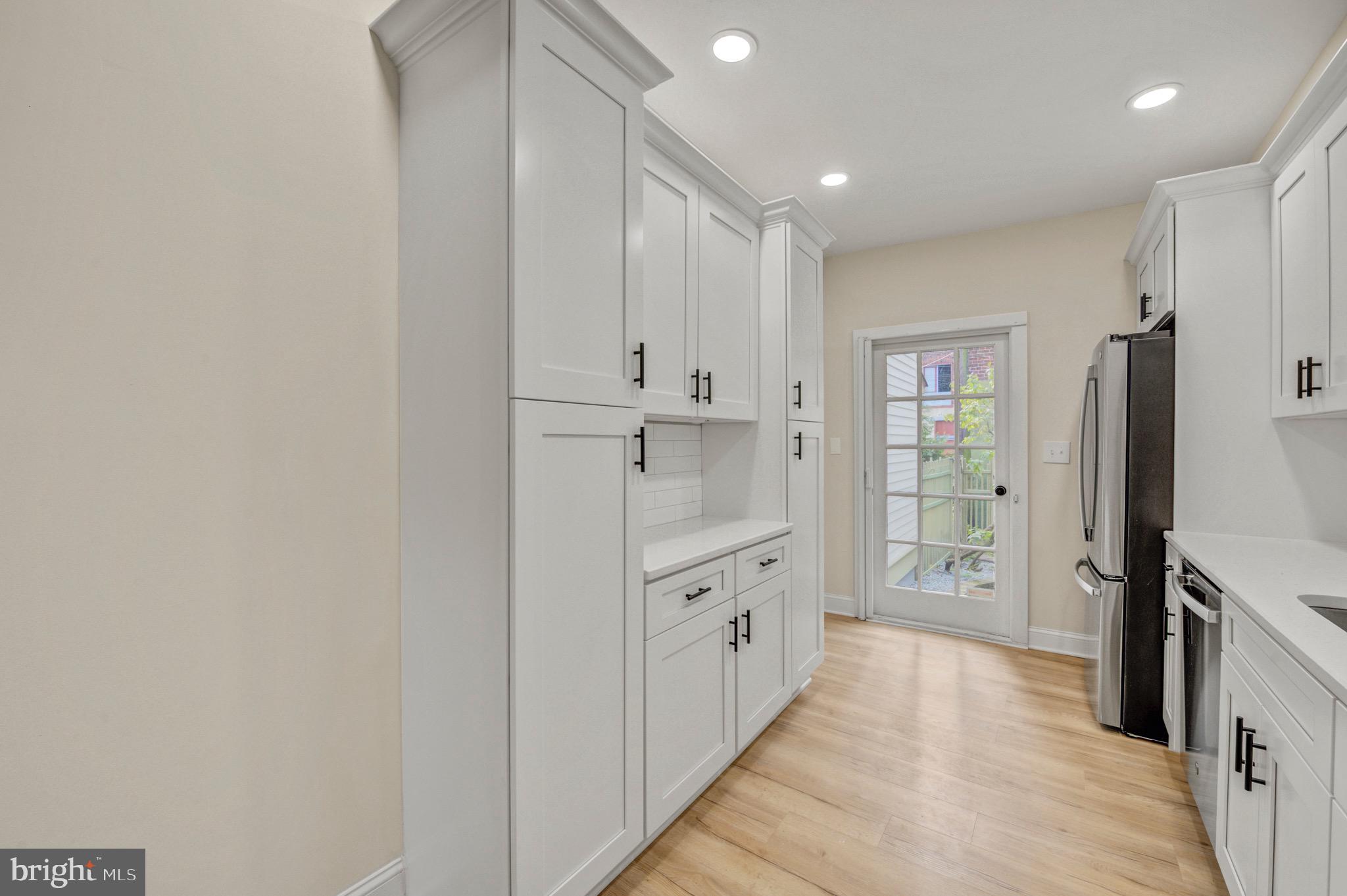 207 Jackson Street Trenton, NJ 08611 - Photo 12 of 37 a bathroom with granite countertop a sink a toilet and shower