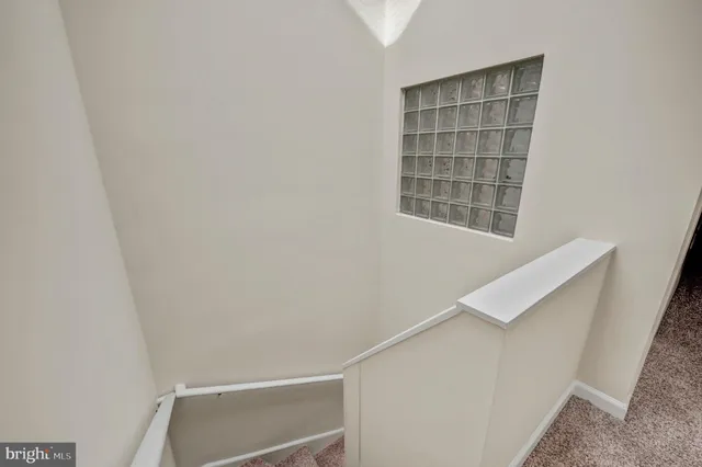 a view of room with stairs and window