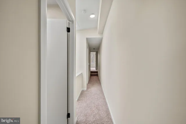 a view of a hallway with a white walls