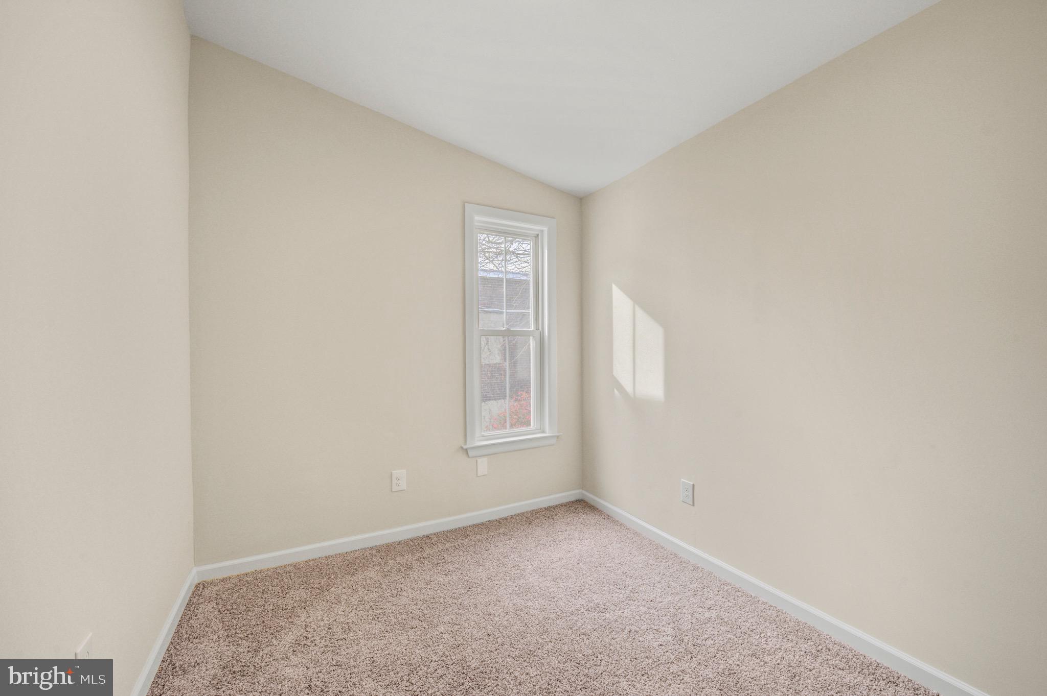 207 Jackson Street Trenton, NJ 08611 - Photo 18 of 37 a view of an empty room with a window