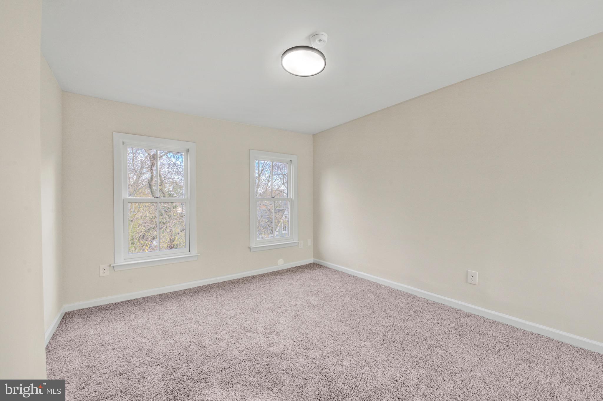207 Jackson Street Trenton, NJ 08611 - Photo 29 of 37 an empty room with windows and closet