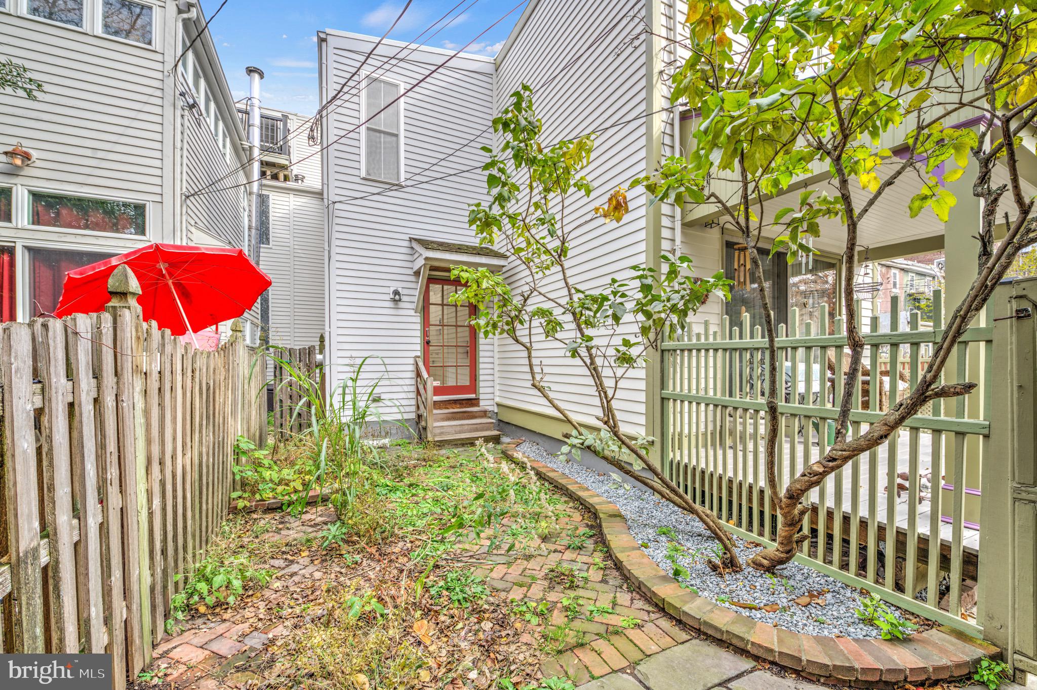 207 Jackson Street Trenton, NJ 08611 - Photo 37 of 37 a view of a house with a small yard and wooden fence