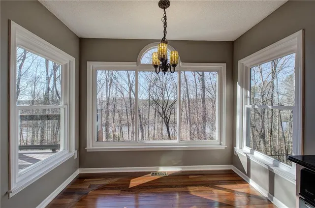 a large kitchen with granite countertop a large stove a sink and a refrigerator