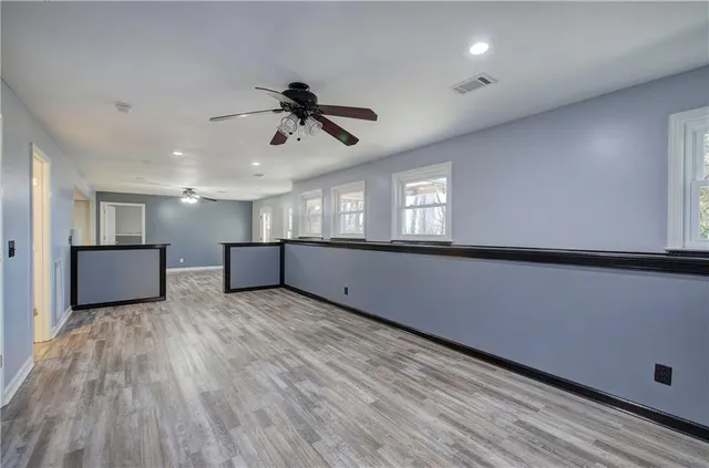 a view of room with wooden floor