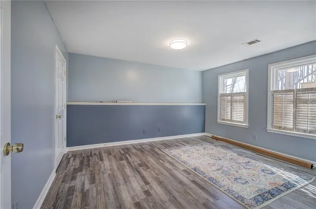 a view of a backyard with iron fence