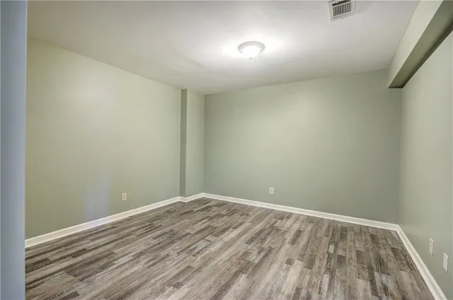 a view of a lake with a house in the background