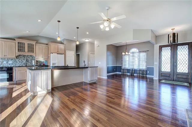 a view of kitchen with cabinets and wooden floor