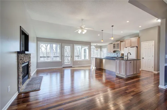 a kitchen with counter top space a sink appliances and cabinets