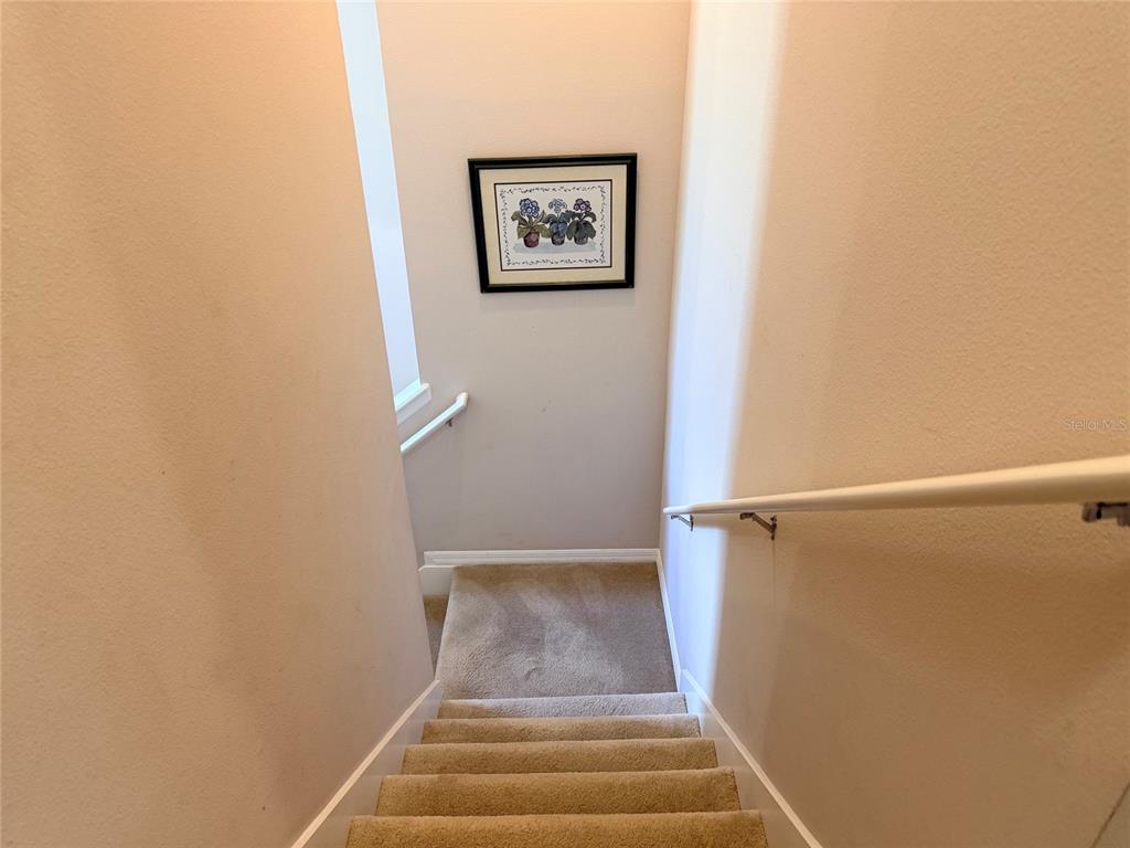 2084 Water Tupelo Way Ocoee, FL 34761 - Photo 12 of 34 a view of staircase with wooden floor