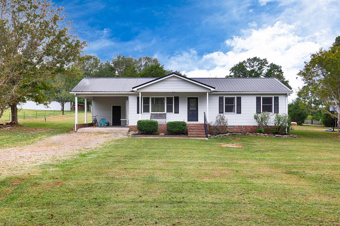 954 Veto Road Prospect, TN 38477 - Photo 1 of 23 a front view of a house with a yard