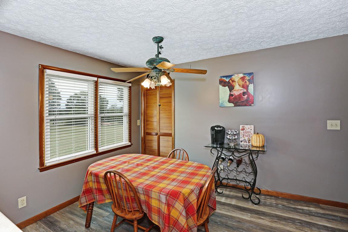 954 Veto Road Prospect, TN 38477 - Photo 14 of 23 a bedroom with a bed and a chandelier