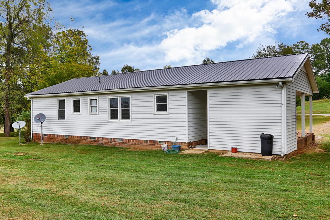954 Veto Road Prospect, TN 38477 - Photo 22 of 23 a view of a house with a yard