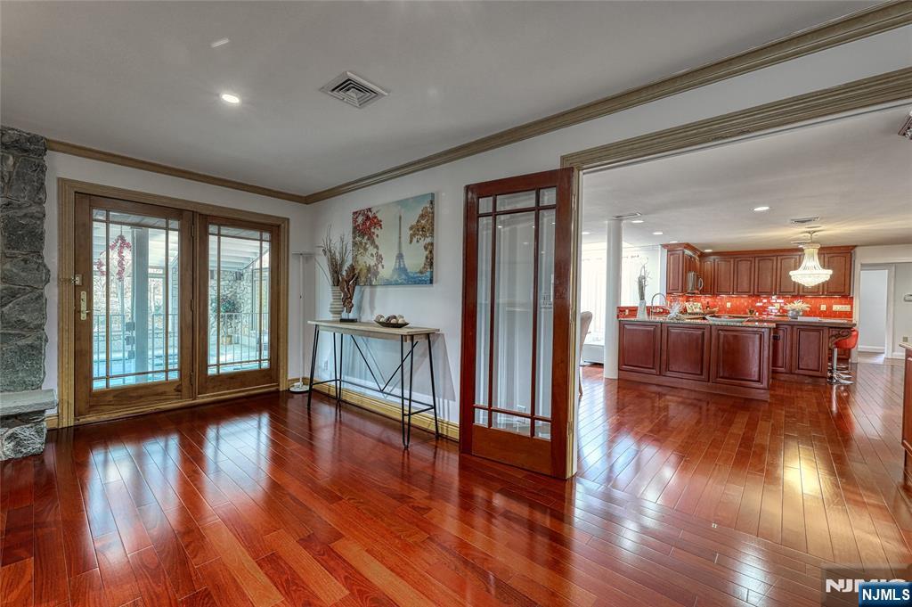 91 Chestnut Ridge Road Saddle River, NJ 07458 - Photo 13 of 50 a hallway with wooden floor and furniture