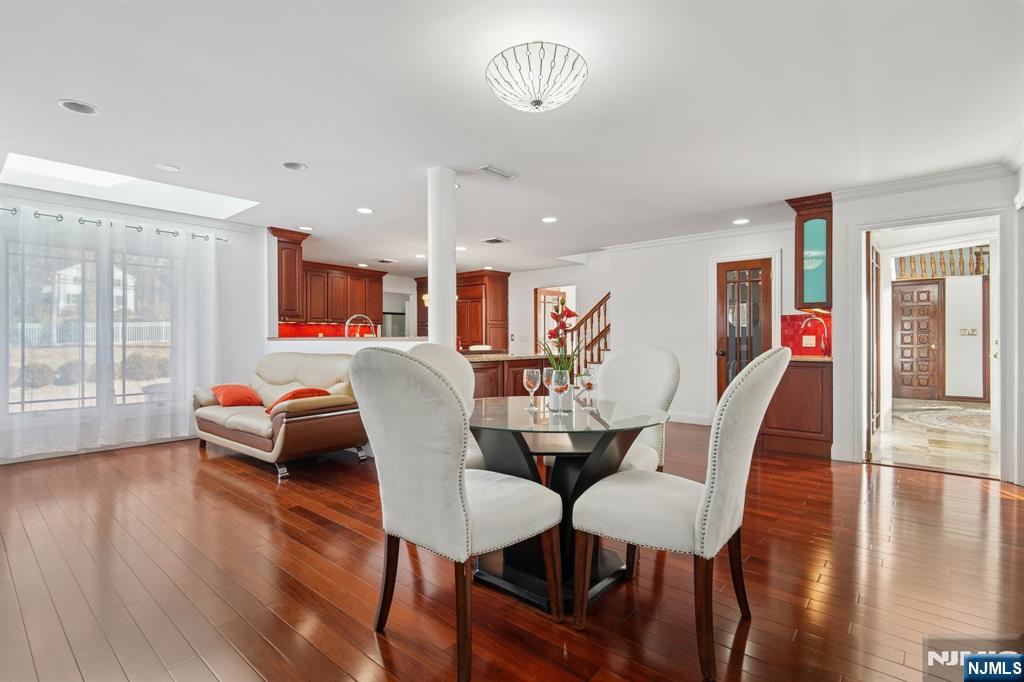 91 Chestnut Ridge Road Saddle River, NJ 07458 - Photo 16 of 50 a view of a dining room with furniture and wooden floor