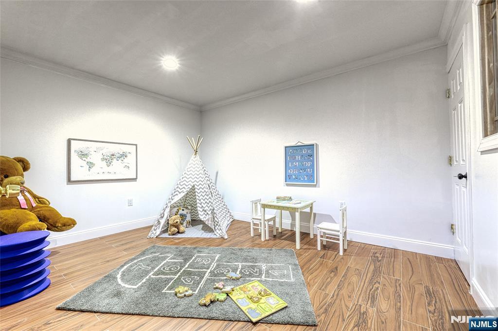 91 Chestnut Ridge Road Saddle River, NJ 07458 - Photo 25 of 50 a living room with furniture and a wooden floor