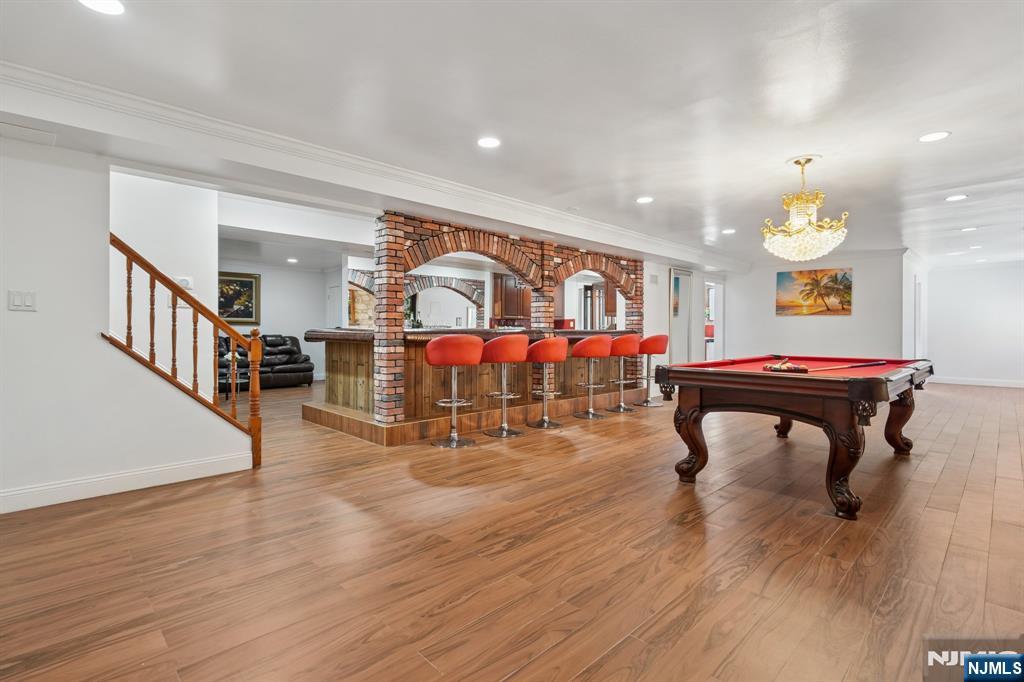 91 Chestnut Ridge Road Saddle River, NJ 07458 - Photo 33 of 50 a living room with furniture a wooden floor and next to a window