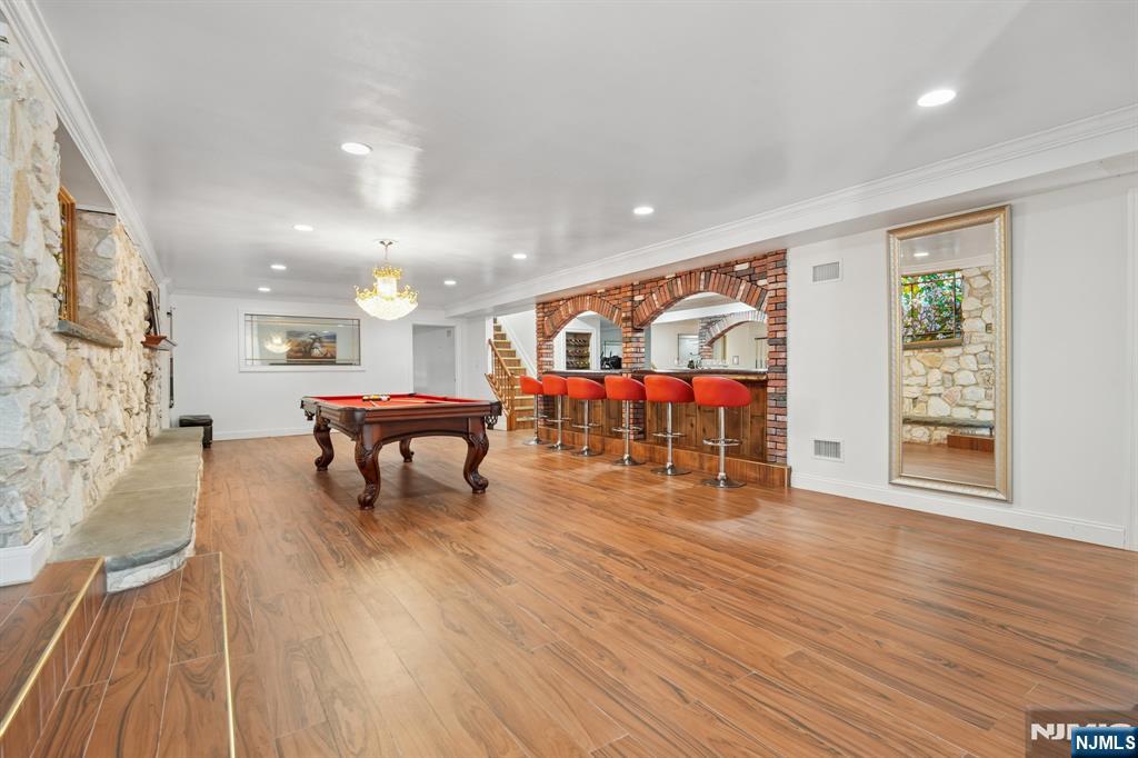 91 Chestnut Ridge Road Saddle River, NJ 07458 - Photo 34 of 50 a living room filled with furniture and a wooden floor
