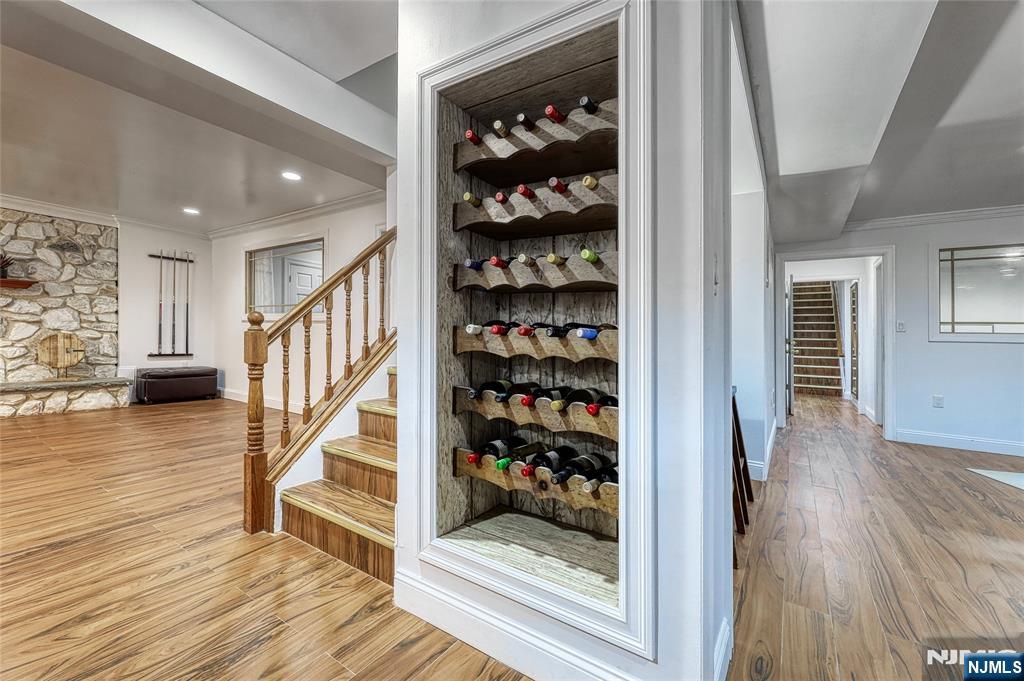 91 Chestnut Ridge Road Saddle River, NJ 07458 - Photo 36 of 50 a view of a hallway with wooden floor and staircase