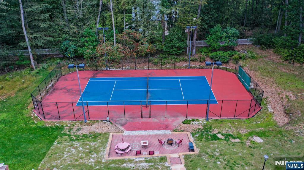 91 Chestnut Ridge Road Saddle River, NJ 07458 - Photo 40 of 50 a view of a backyard with sitting area and garden