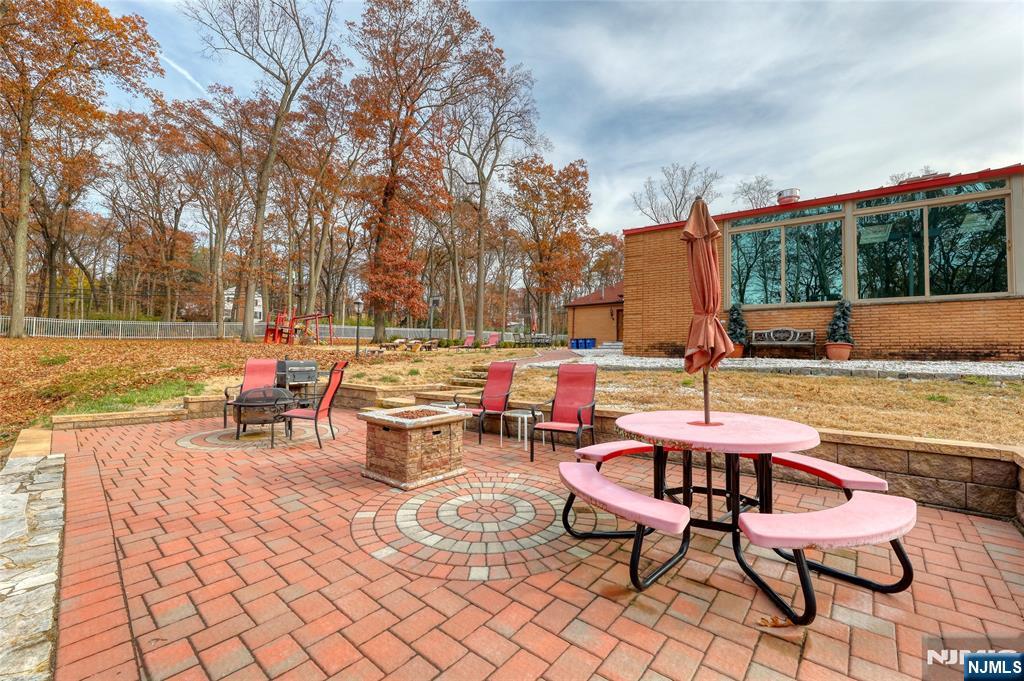 91 Chestnut Ridge Road Saddle River, NJ 07458 - Photo 45 of 50 a view of a patio with chairs and tables