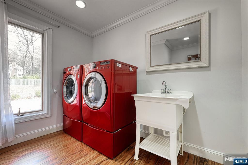 91 Chestnut Ridge Road Saddle River, NJ 07458 - Photo 48 of 50 a bathroom with a toilet a sink and a mirror