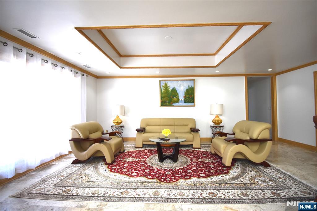 91 Chestnut Ridge Road Saddle River, NJ 07458 - Photo 8 of 50 a living room with furniture and a rug