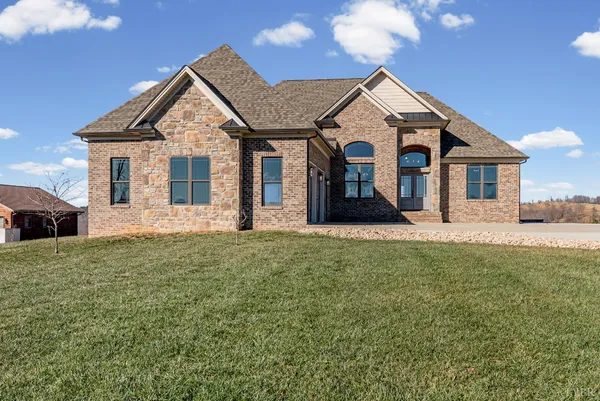 a front view of a house with a yard