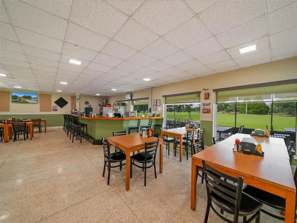 an outdoor living space with furniture and garden view