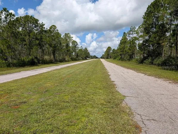 a view of a lake with a yard