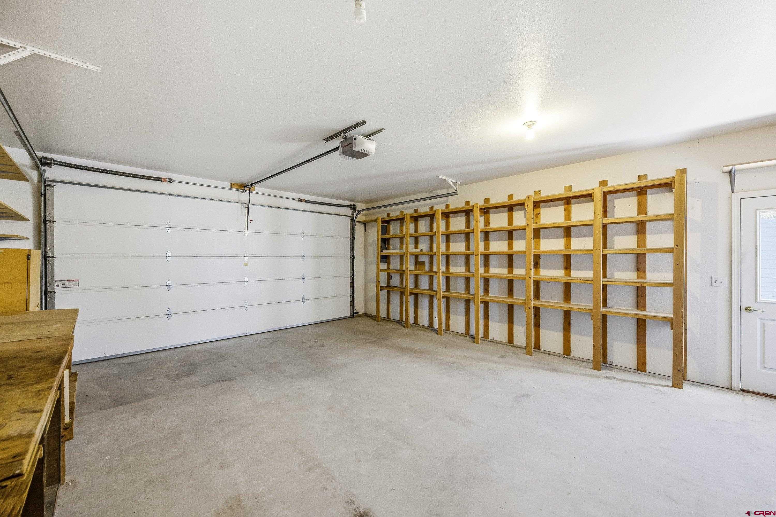 24239 Valley View Circle Cedaredge, CO 81413 - Photo 14 of 18 a view of an empty garage