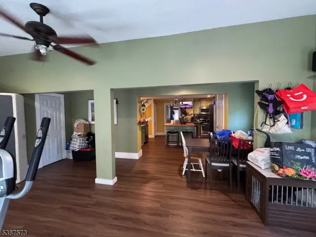 a view of a dining room with furniture and wooden floor